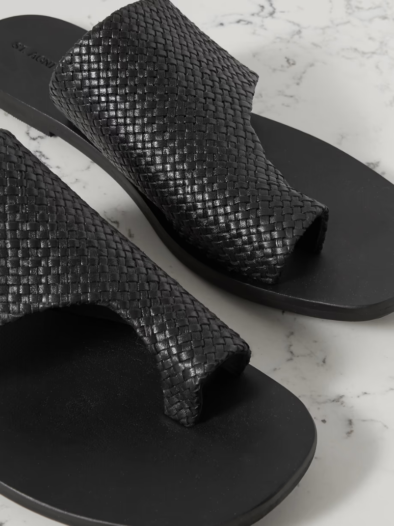 Asymmetric woven leather slides