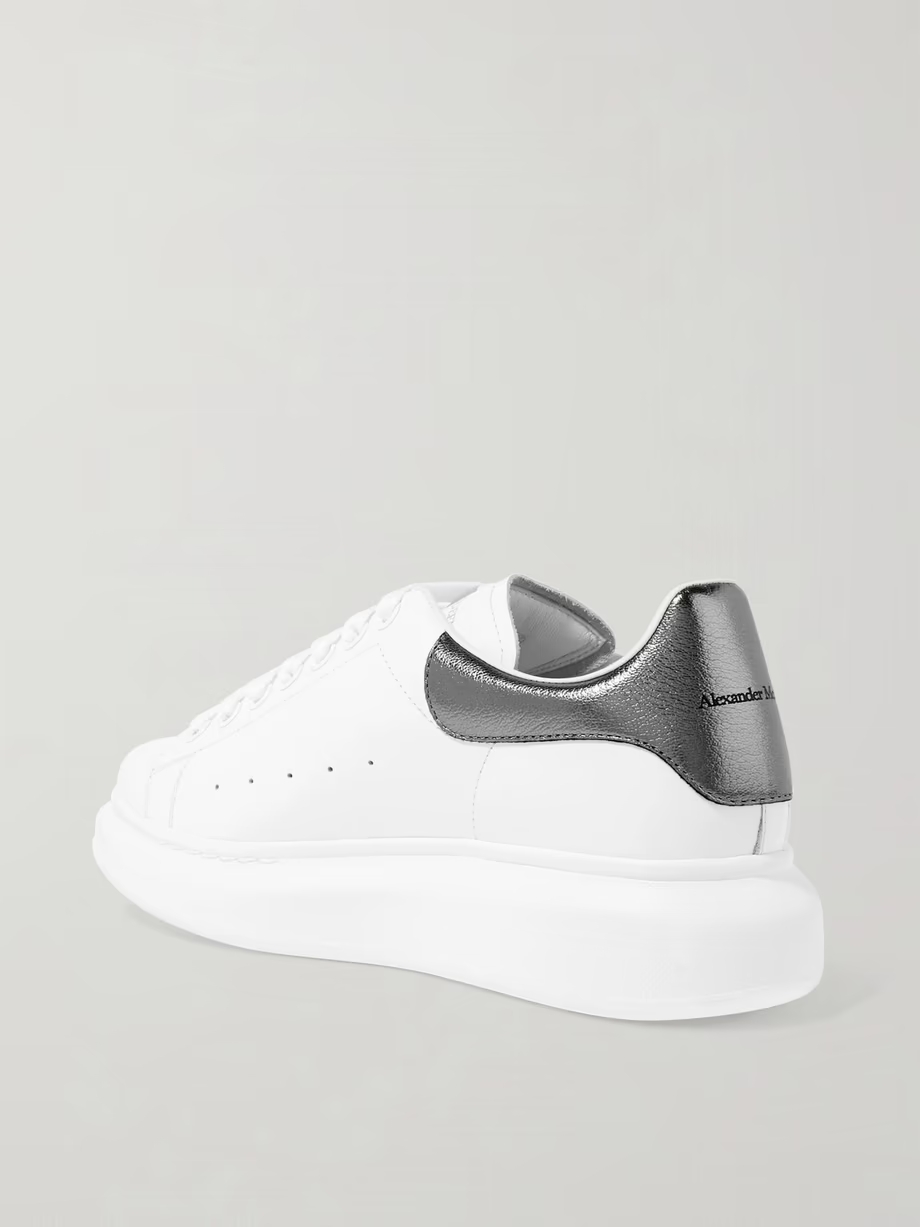 Metallic-trimmed leather exaggerated-sole sneakers